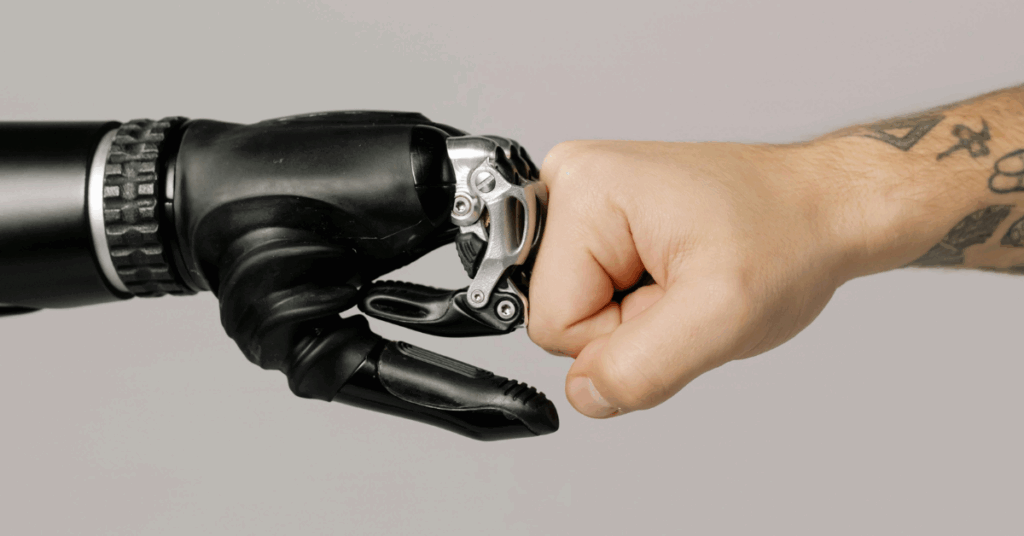 A robotic hand and human fist bump symbolising AI and human collaboration in cloud operations.