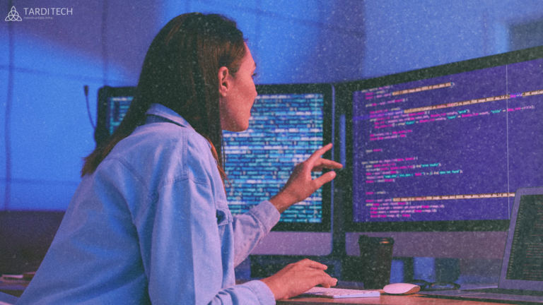 Engineer reviewing code across multiple screens, representing cloud infrastructure ownership, review responsibility, and operational visibility.